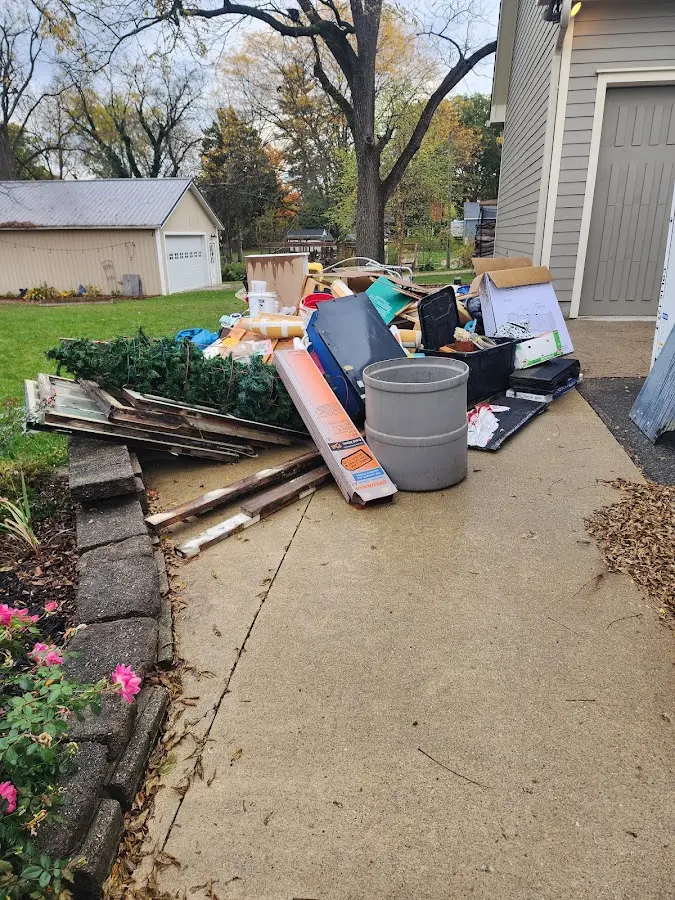 Dumpster being loaded with debris for 3 Yard Dumpster Rental in Sacaton